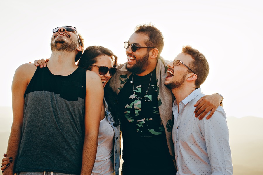 Group of people laughing together.