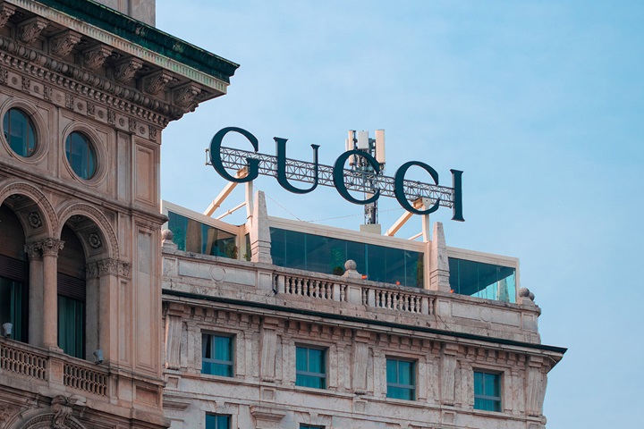  Gucci sign on the top of a building in Milan