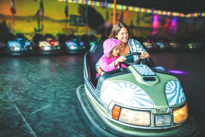 Mother and child in bumper car